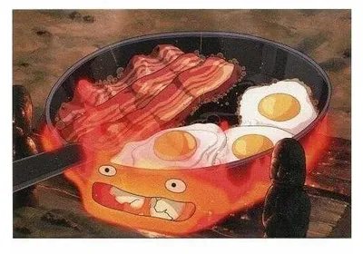 Zdjęcie produktu dla Pocztówka „Ruchomy zamek” – Calcifer z bekonem i jajkiem