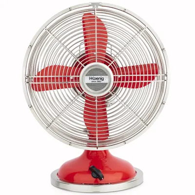 A vintage-style red table fan with a silver grill.