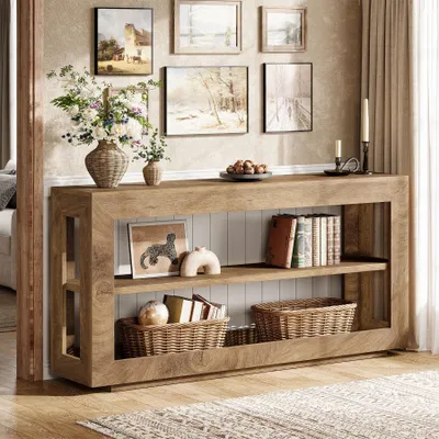 A console table with decorative items and books on display.