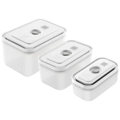 Three white plastic food storage containers of varying sizes are arranged diagonally on a white background.