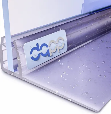 Close-up of a shower door seal with water droplets.