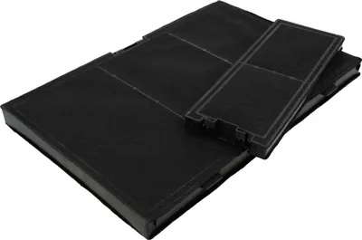 Two black carbon filters are stacked on a white background. The top filter is angled and partially covers the one below it. The filters have a grid-like pattern on their surface and ribbed edges.