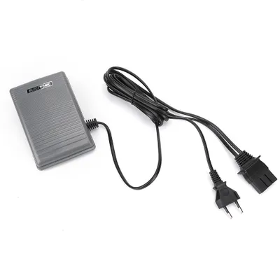 A gray foot control pedal with a black cord and two plugs is shown on a white background.