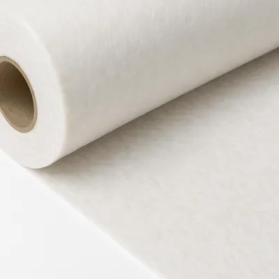 A roll of white non-woven fabric, likely for construction or landscaping, is shown diagonally across a white background.