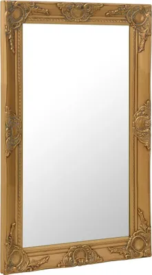A gold-colored baroque-style wall mirror is shown against a white background.
