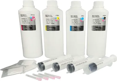 Four bottles of bulk ink for inkjet printers, along with syringes and cleaning wipes, are arranged on a white background.