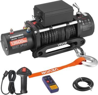 A black electric winch with a synthetic rope, hook, and accessories, including a wired and wireless remote control, displayed on a white background.
