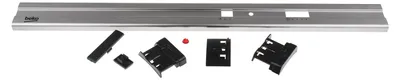 A silver control panel and several black plastic accessories are laid out on a white background.