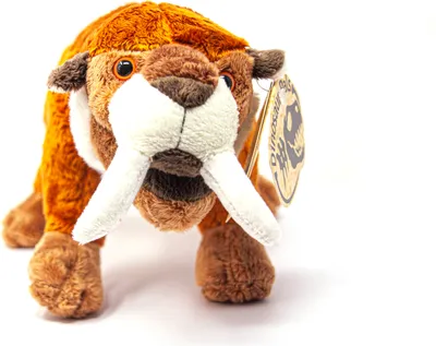 A plush toy of a saber-toothed tiger is shown against a white background.