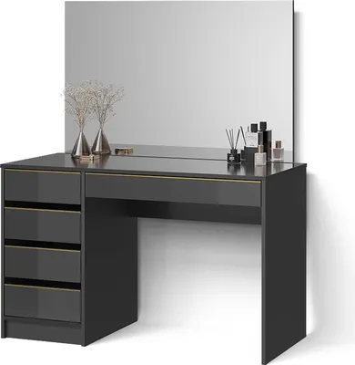 A modern black vanity table with gold accents and a large mirror, decorated with vases and perfume bottles.