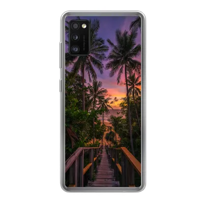 A phone case with a tropical sunset and palm trees.