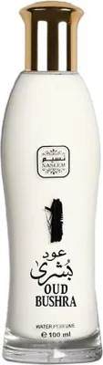 A white bottle of perfume with a gold cap.