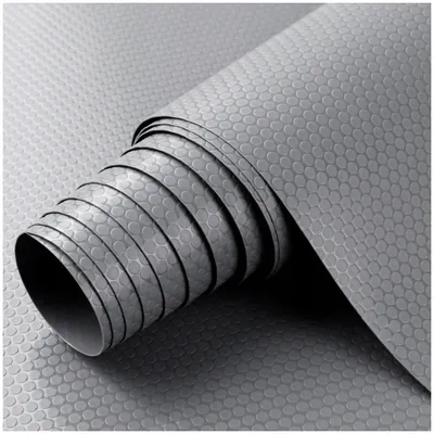 A rolled-up mat with a hexagonal pattern.