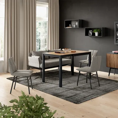 A dining set with a table and chairs in a modern living room.