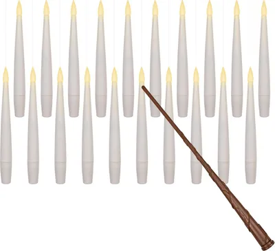 A collection of LED candles and a wand arranged on a white background.
