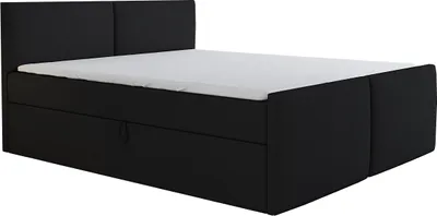 A black boxspring bed with a white mattress and a headboard, shown from a side angle.