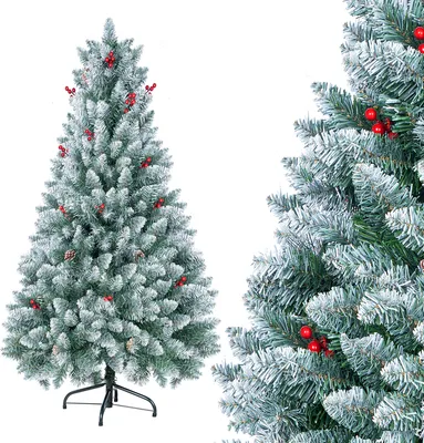 A flocked artificial Christmas tree with red berries and pine cones, shown with a close-up view of its branches on the right.