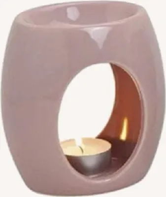 Eine zartrosa Keramik-Duftlampe mit ovaler Form und einer ovalen Aussparung in der Mitte.