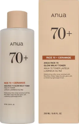 A bottle of Anua Rice 70 + Ceramide Glow Milky Toner and its packaging are shown side-by-side against a white background.