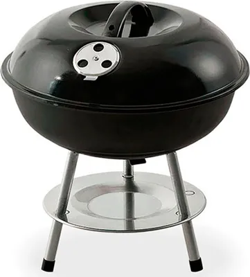 A black freestanding grill with silver legs and a silver ash catcher.