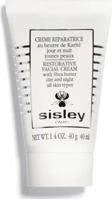 A white tube of Sisley facial cream with silver stripes and black text.