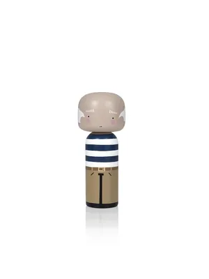 A wooden figurine of an elderly man with white hair, wearing a striped shirt and gold pants, is shown against a white background.