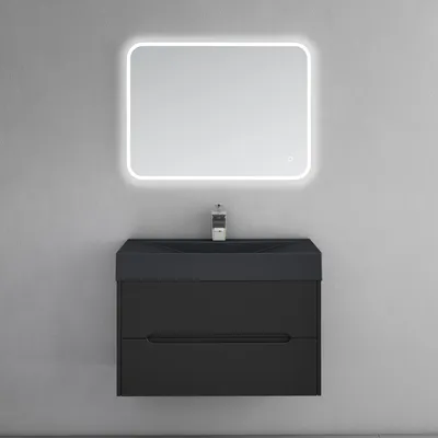 A modern black bathroom vanity with a sink and a backlit mirror mounted on a gray wall.