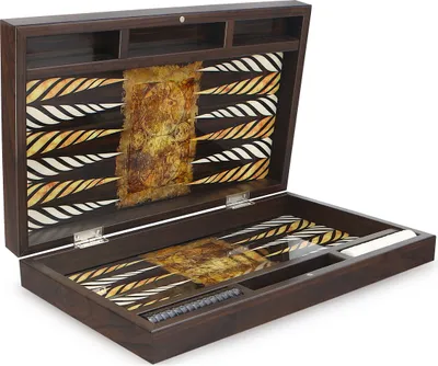 An open backgammon board with a decorative map-like design on the playing surface and lid.