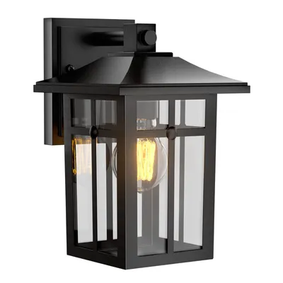 A black outdoor wall light with clear glass panels and an exposed Edison-style bulb.