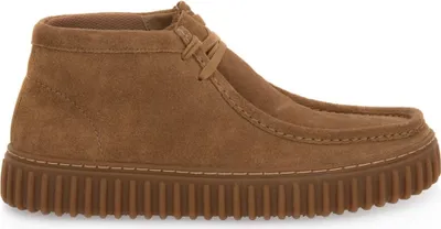 A single brown suede boot is shown from the side against a white background.