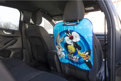 Productafbeelding van LOONEY TUNES Rugleuningbeschermer 10982. Achterkant: 56 cm, breedte: 45 cm. Materiaal: PVC