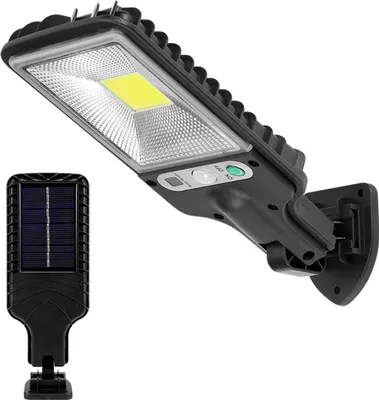 A solar-powered LED street light with a separate solar panel.