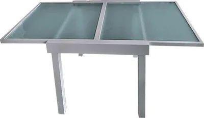 A table with a glass top, shown from a slightly elevated angle.