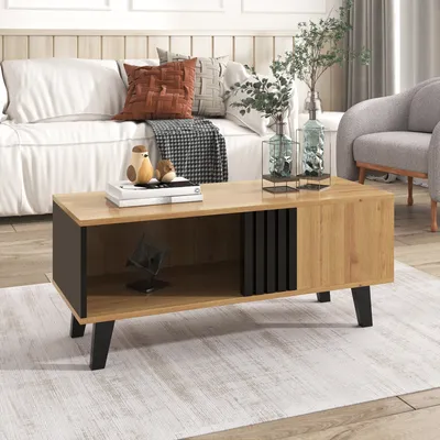 A living room scene with a couch, armchair, and coffee table.