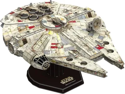 A 3D model of the Millennium Falcon spaceship from Star Wars, displayed on a stand.