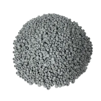 A large pile of small, gray, circular LEGO plates.