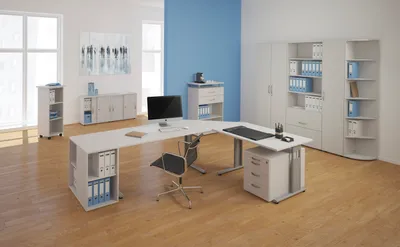A modern office setting with a corner desk, filing cabinets, and a bookshelf.