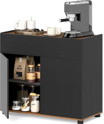 A black buffet cabinet with a drawer and two doors, used to store coffee-related items. It features a coffee machine on top, along with mugs and coffee beans in jars.