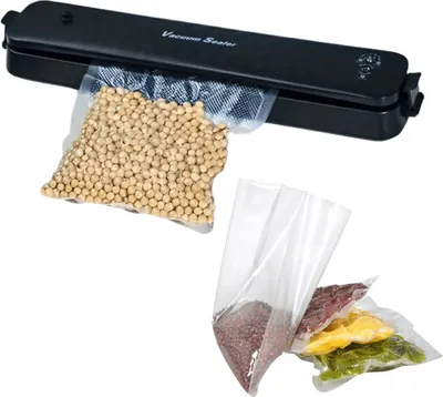 A vacuum sealer with bags of food items.