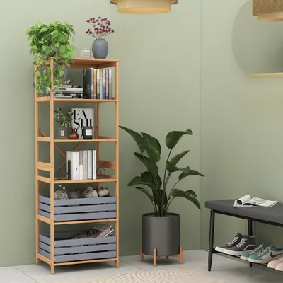 A wooden bookshelf filled with books and decorative items, next to a large potted plant and a shoe rack with shoes.