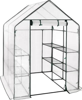 A white greenhouse with shelves inside, shown from the front.