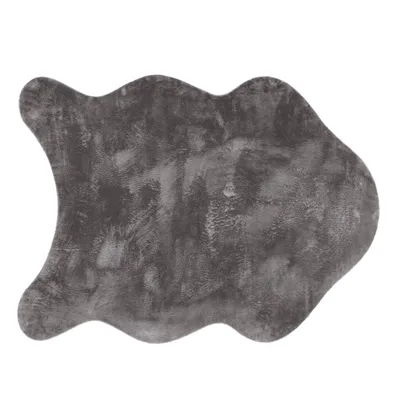 A grey, irregularly shaped rug with a textured surface, isolated on a white background.
