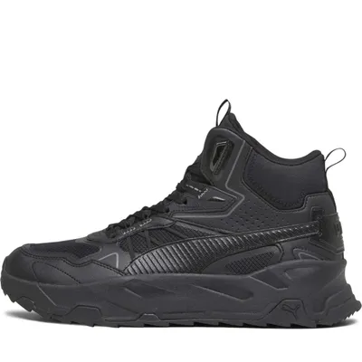A black Puma mid-top sneaker is shown from the side against a white background.