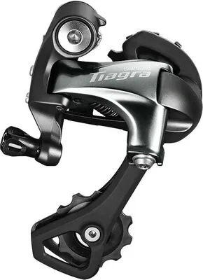 A close-up studio shot of a bicycle rear derailleur.