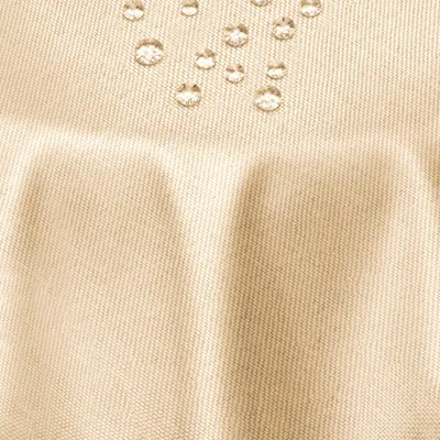 Produktbild von DecoHomeTextil Leinen Optik Tischdecke Champagner Oval 130 x 220 cm mit Lotus Effekt Abwaschbar