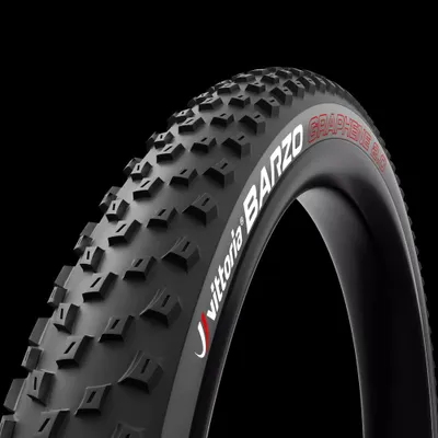 A close-up studio shot of a bicycle tire against a black background.