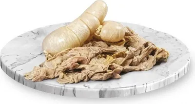 A pile of pig intestines on a marble plate.