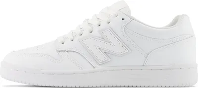 A side view of a white New Balance sneaker.