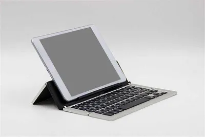 Zdjęcie produktu dla Przenośna klawiatura Bluetooth z podstawką pod tablet - kolor złoty