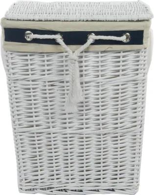 A white wicker laundry basket with a navy and beige fabric trim and a drawstring closure.